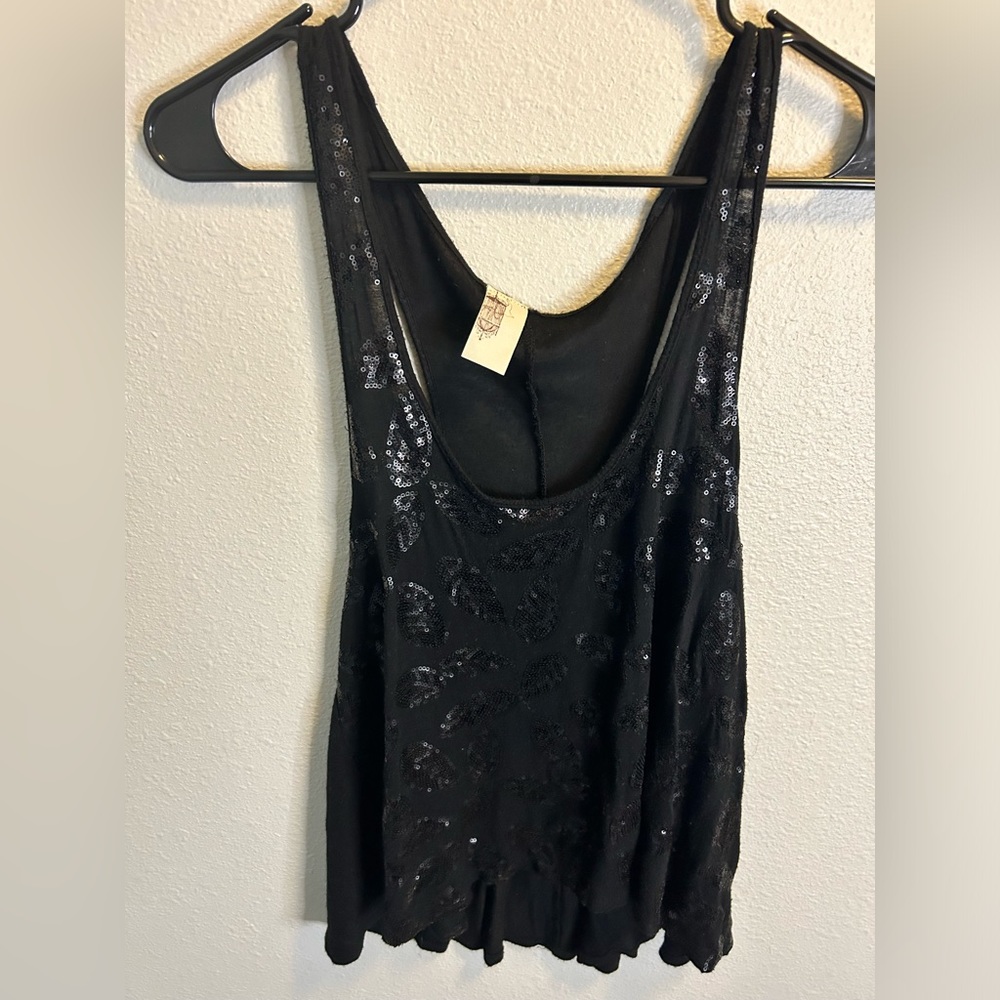 Size Large. High/low sequin top.